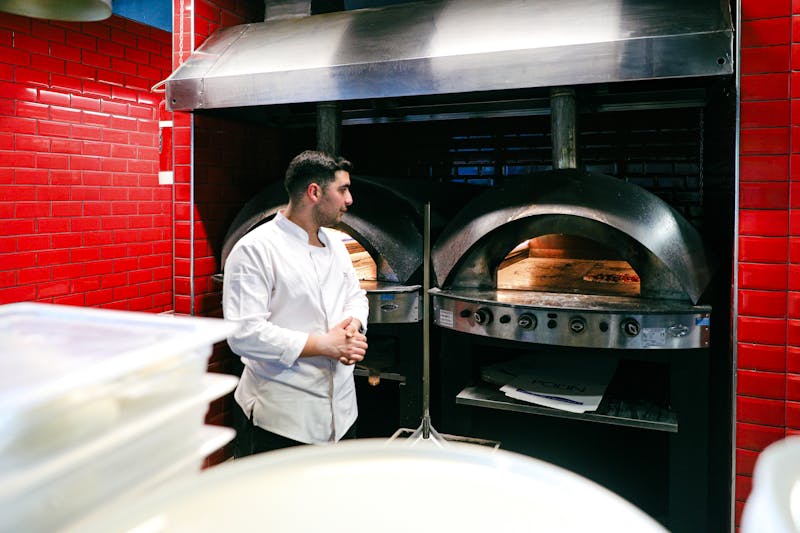 Inside the Green Lantern Pizza kitchen — warm, welcoming and full of aroma