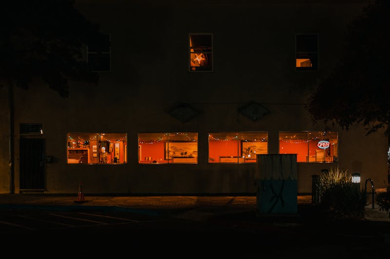 Warm and inviting pizza restaurant ambiance at night